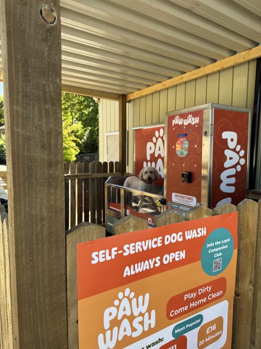 The self-service dog wash bay and machine under its timber-and-steel shelter